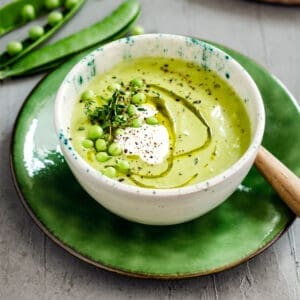bowl of green soup made from a pea soup recipe