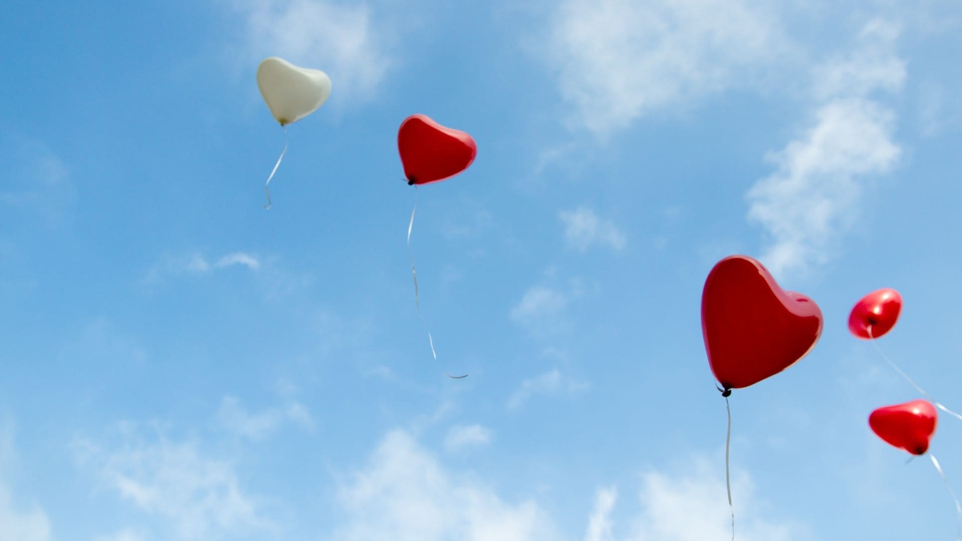heart healthy balloons flying in the blue sky