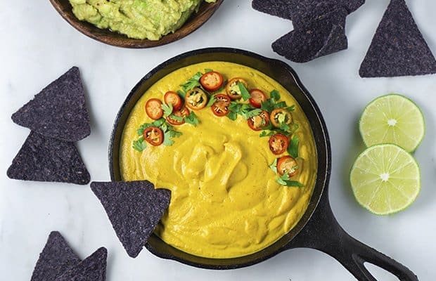 vegan cheese sauce with blue corn nachos