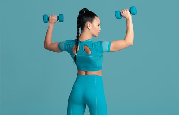 woman doing lat exercises with dumbbells