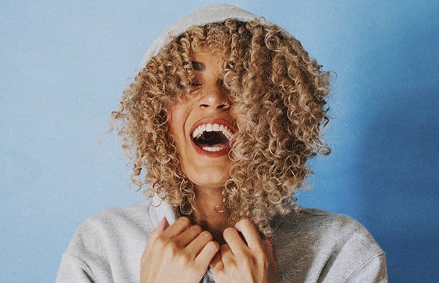 A woman with good hair because she's using Hair Protein Treatments