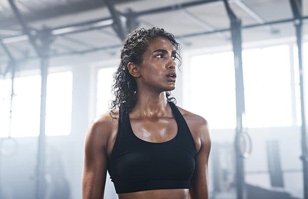 A sweaty woman has done an aerobic workout