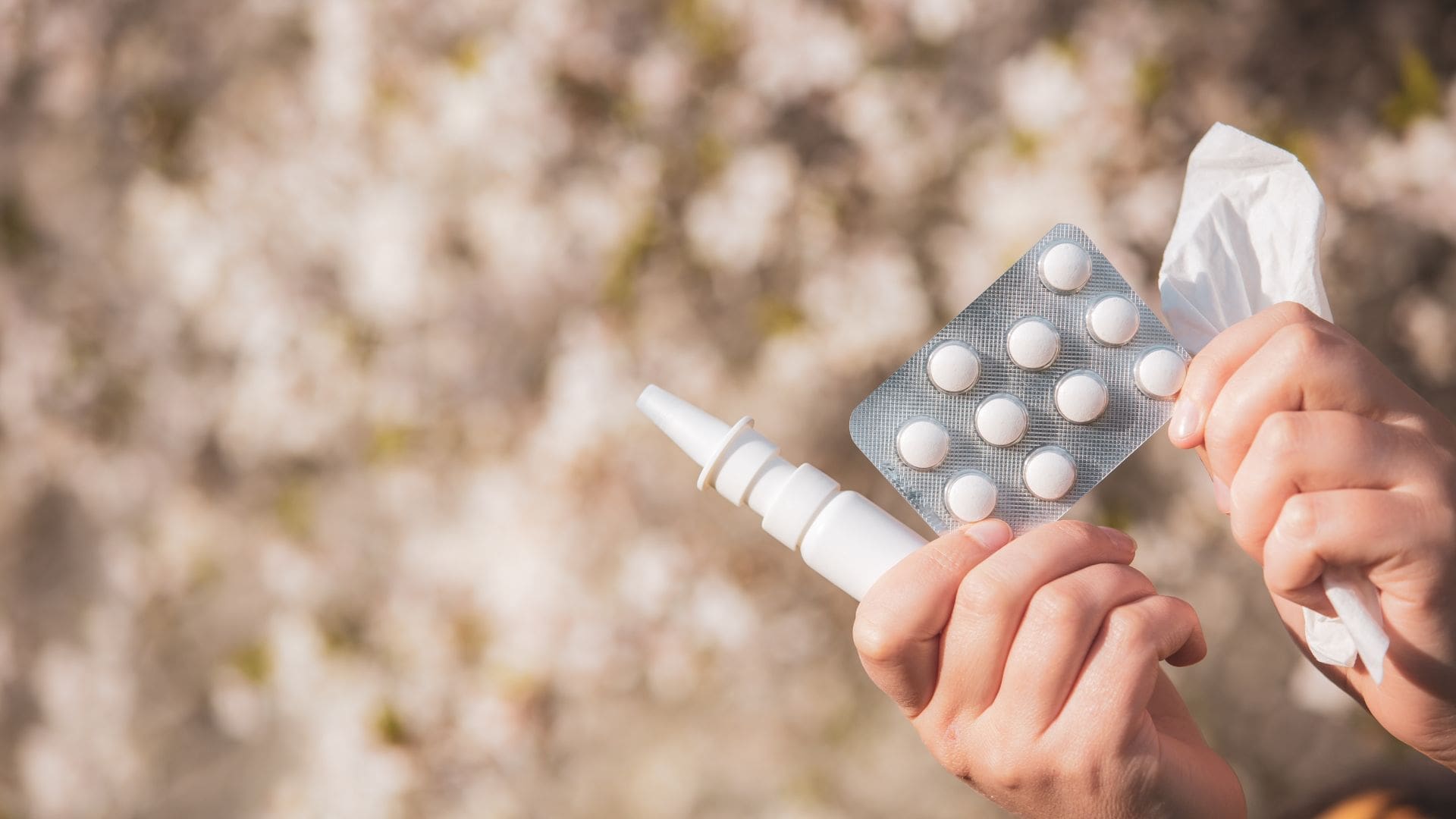 Image of nasal spray, medication and tissues, used to get rid of a stuffy nose