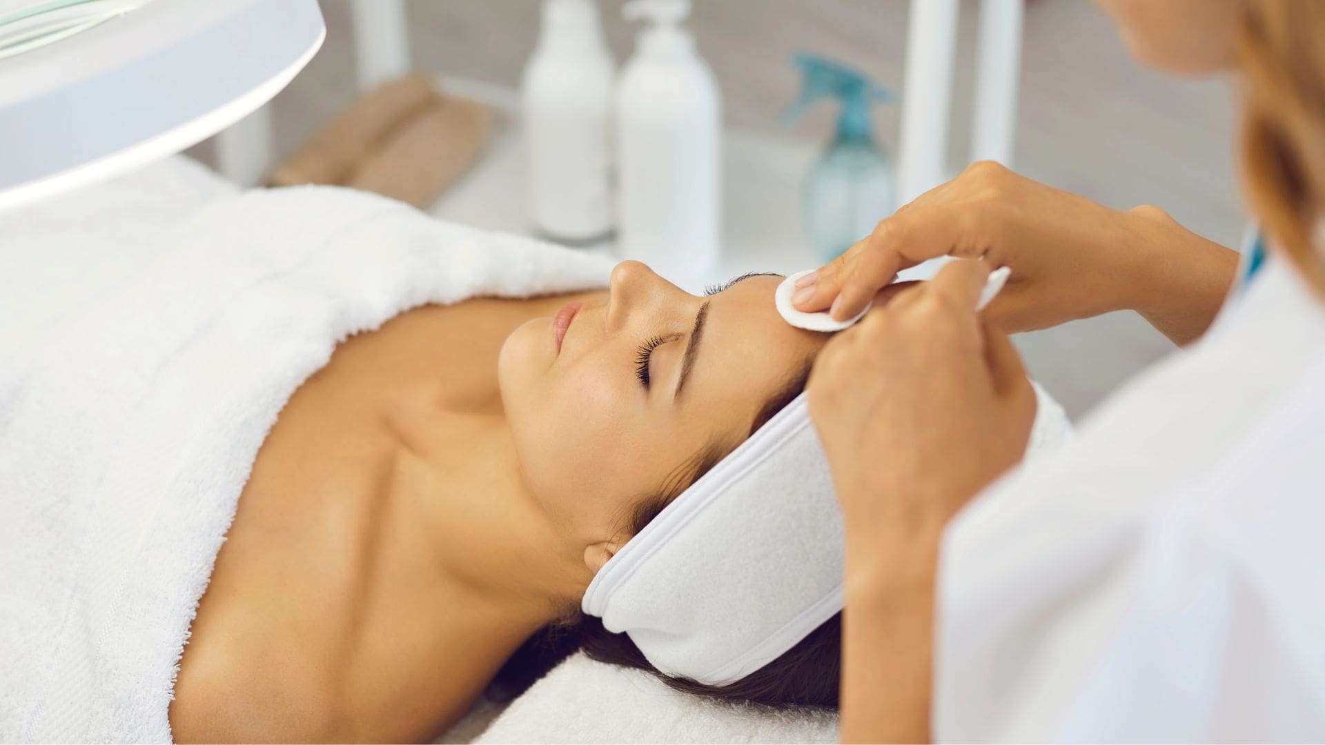 woman at a spa lying down having a pro peel treatment