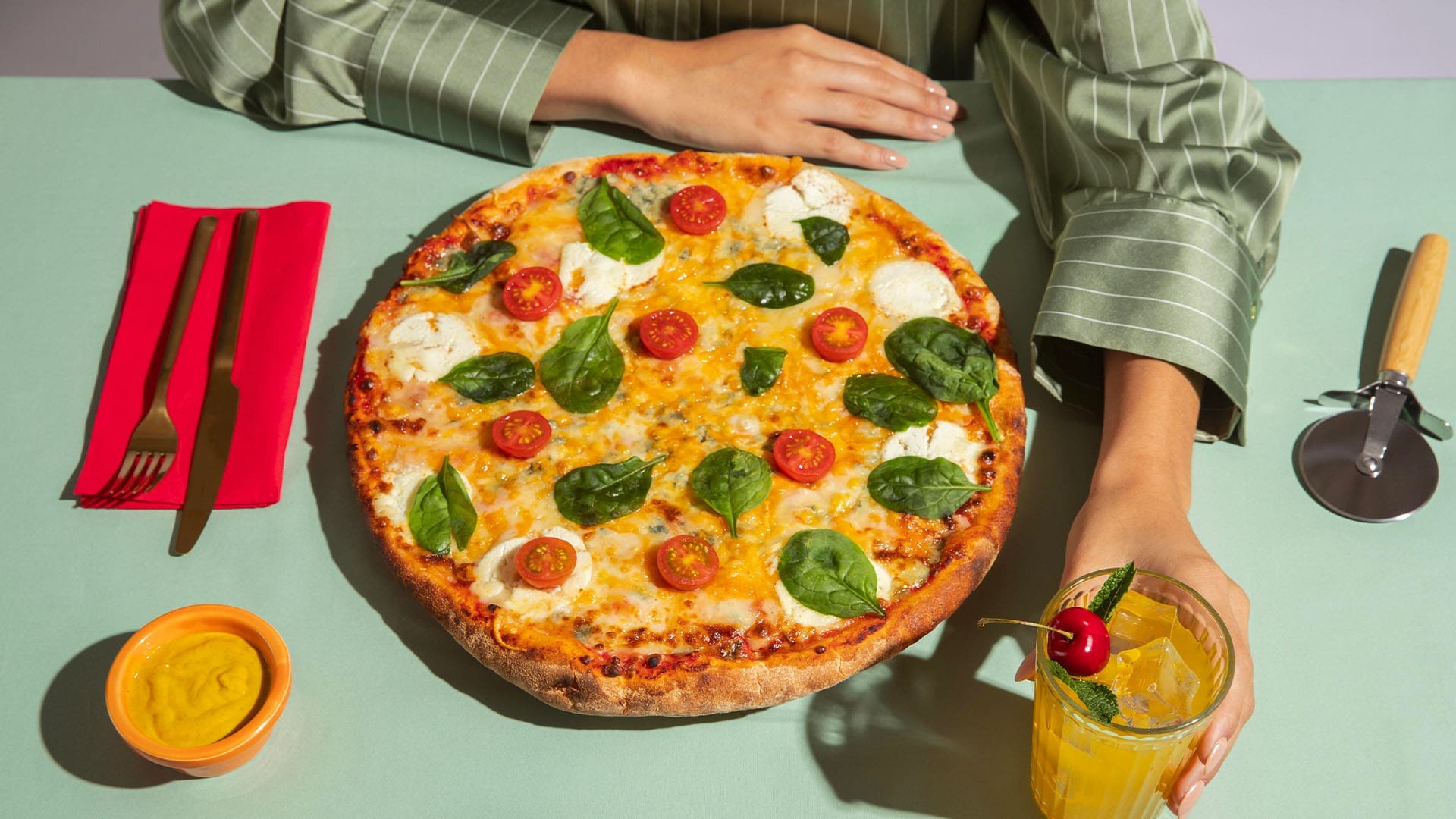 Young woman eating pizza