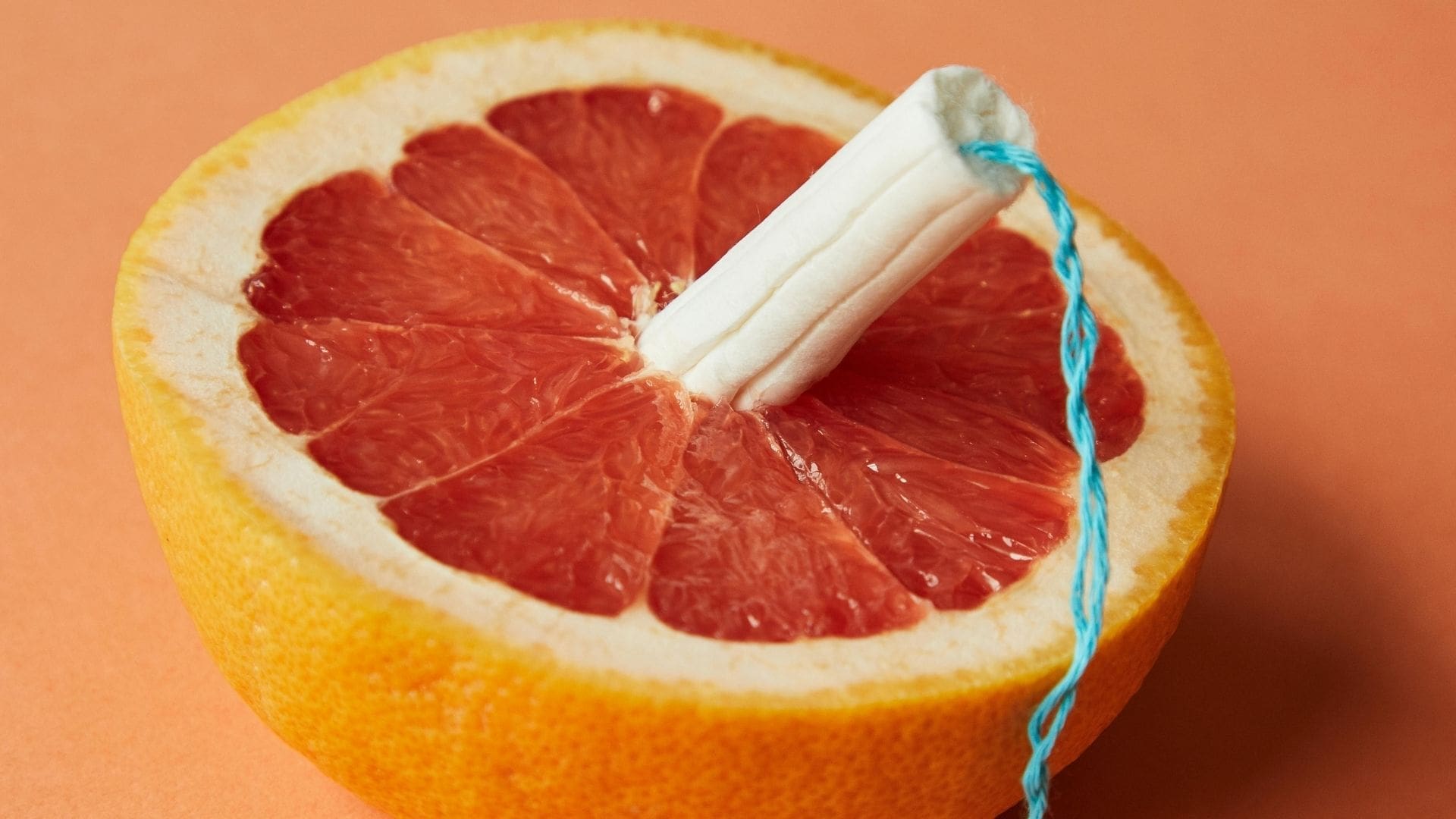 Grapefruit with a tampon stuck in it