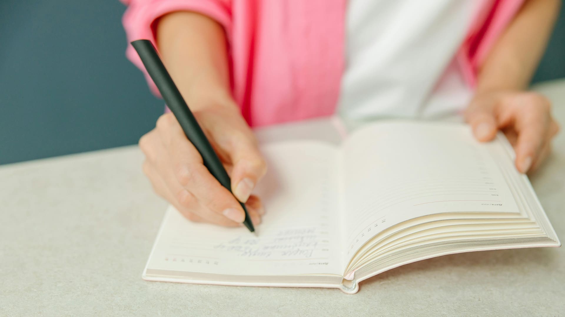 Woman creating a dopamine menu in her journal