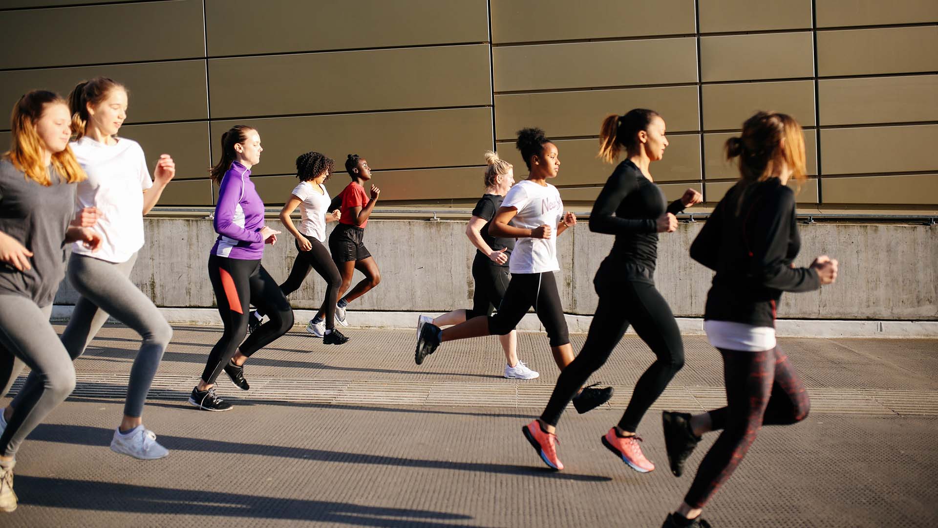 Women of all ages running through the city