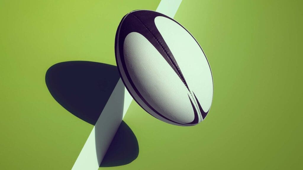 Rugby ball hopping off a green step